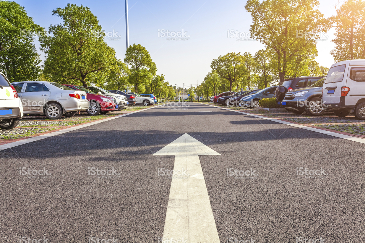 stock-photo-62927944-arrow-on-the-road-showing-the-way-out-of-a-parking